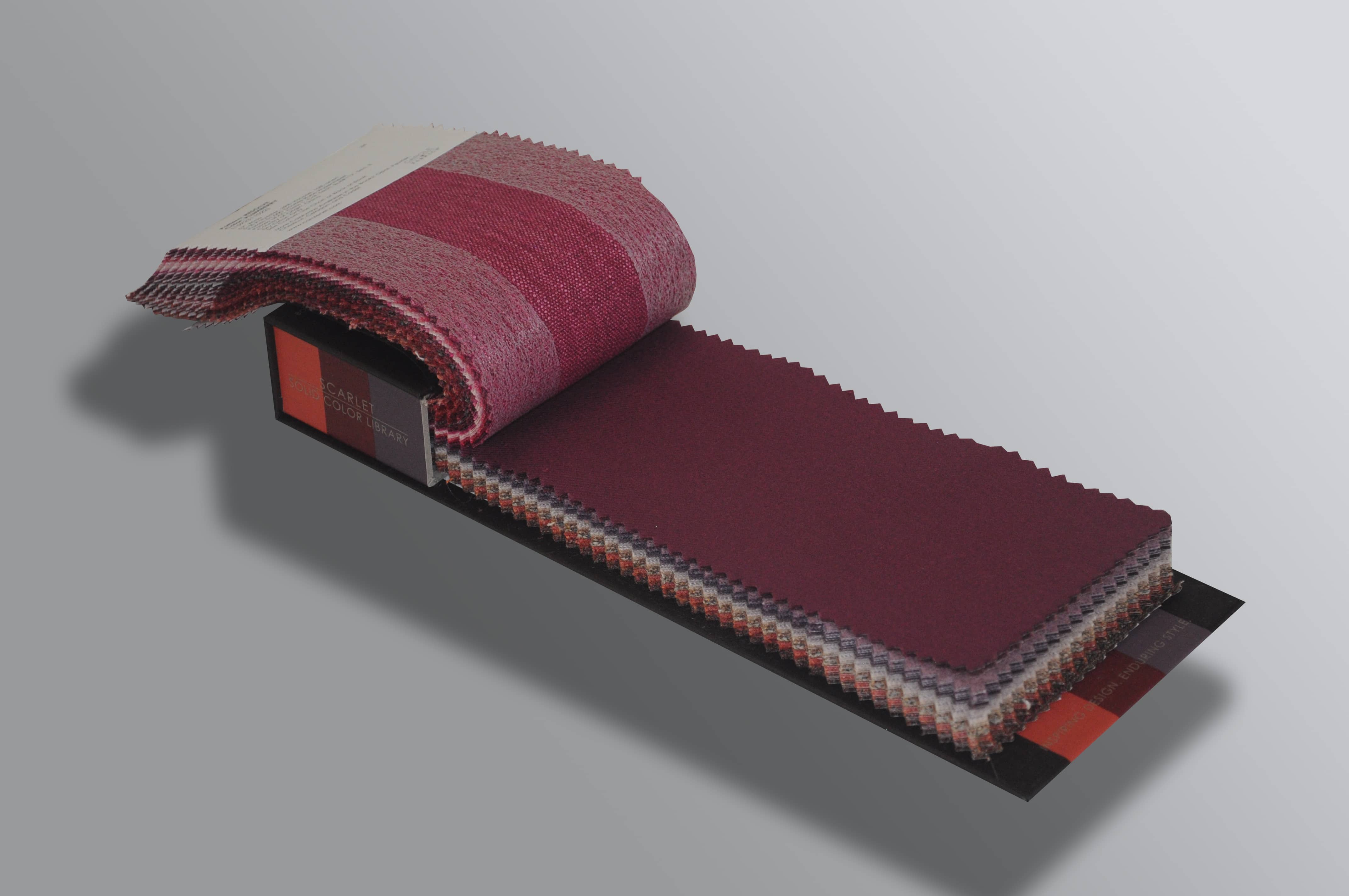 Maroon stack book with paper strip
