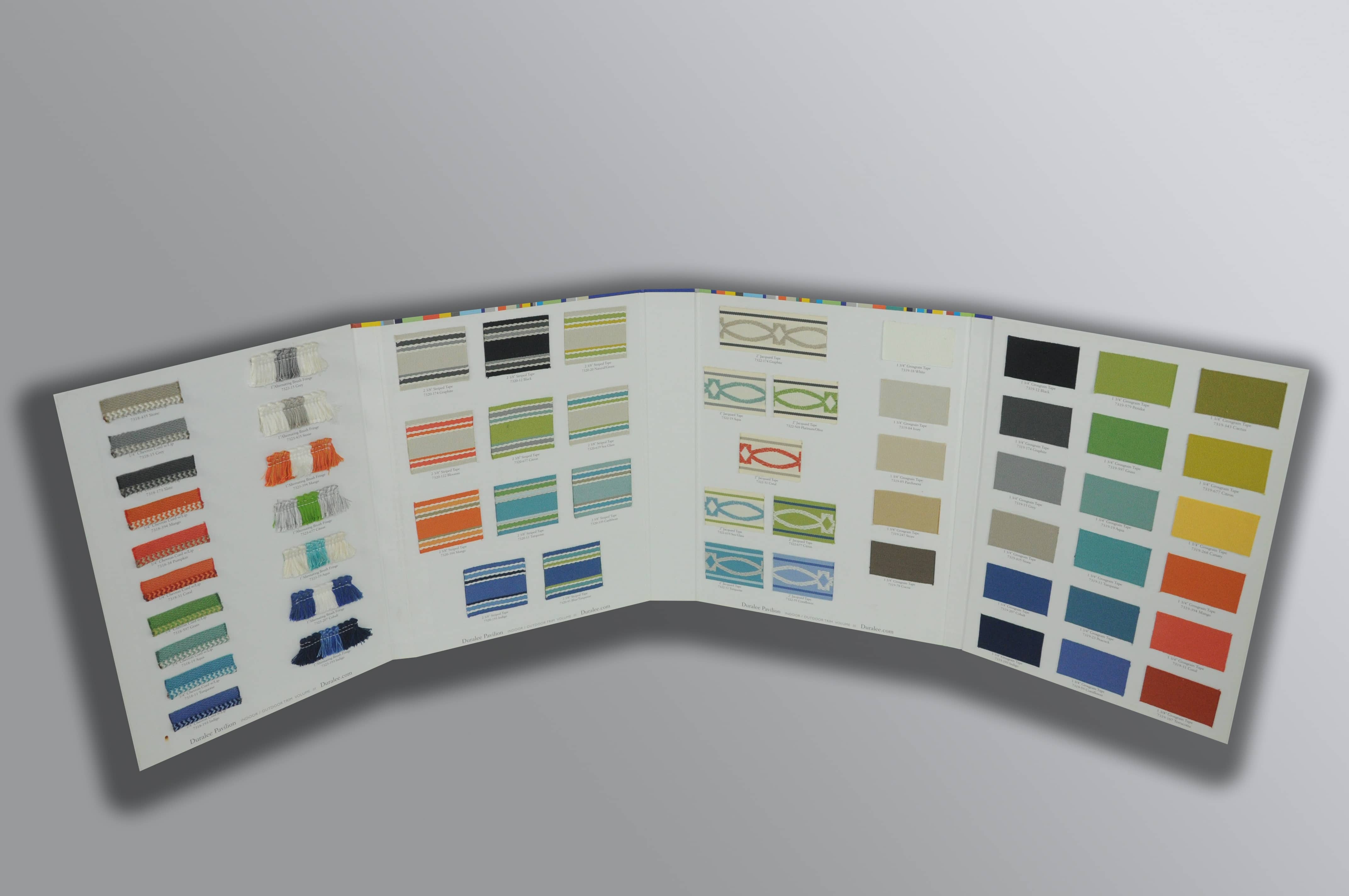 White sample board with several different colored fabric samples